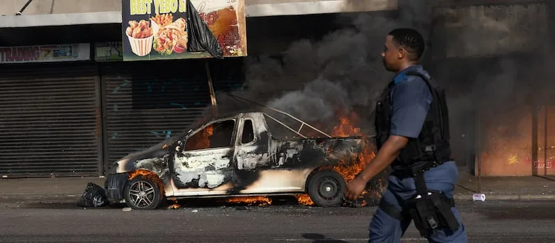 WATCH | Burnt cars stripped as calm returns to Durban CBD