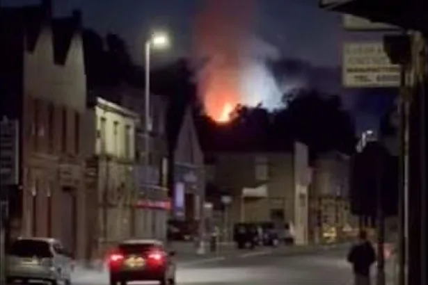 Body found after fire rips through factory as murder detectives launch investigation