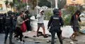Los migrantes entran en el recurso del Puerto de Ceuta, tras una mañana de tensión y cargas durante su traslado