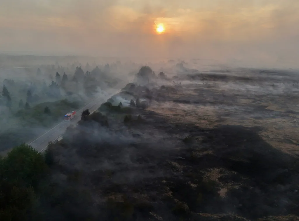 Firefighters battle massive wildfires in Belgium and Greece as 2 die on an island near Athens