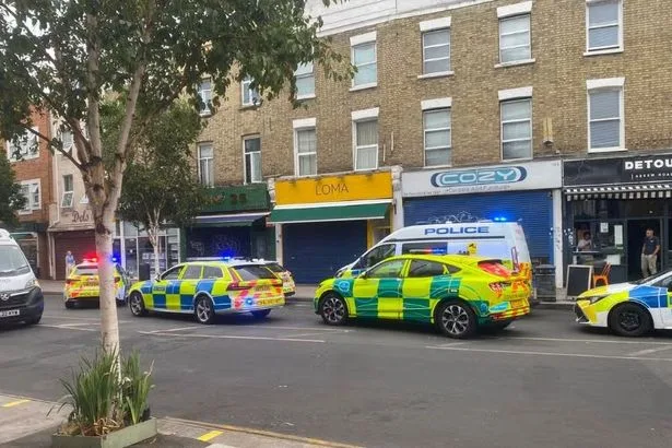 One dead and two injured in stabbing on London street as police swarm area