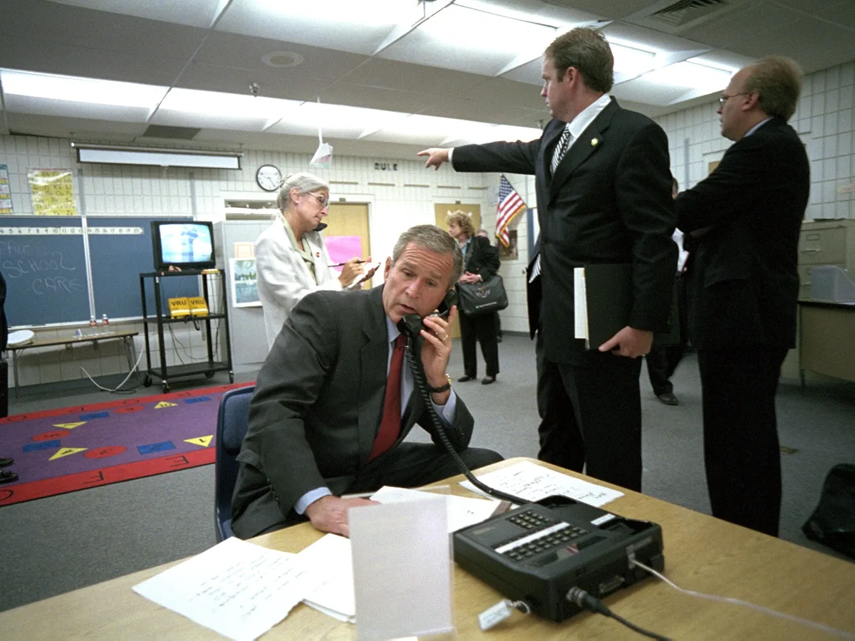 Photos show the moment President George W. Bush first learned of the 9/11 attacks — and how the president's day unfolded