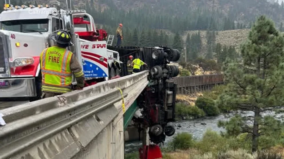 WATCH: 18-wheeler outside California's Lake Tahoe left dangling from overpass after crash