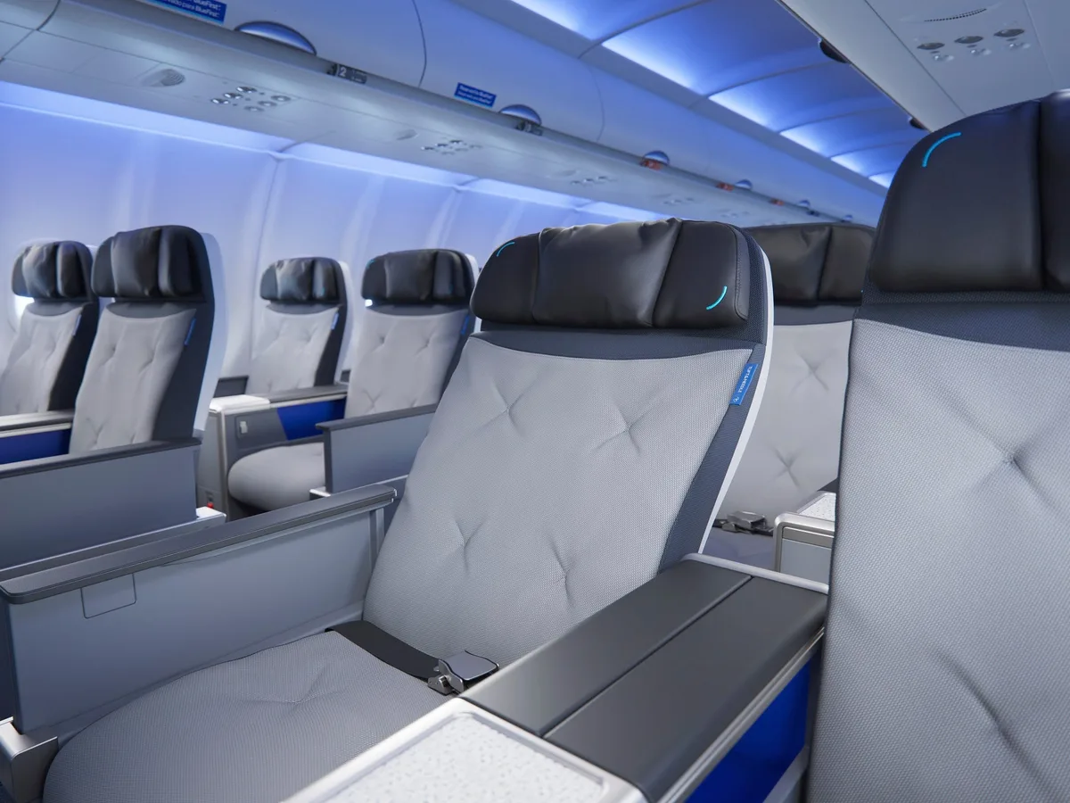 JetBlue unveiled its new domestic first-class seat with more space, Bluetooth, and customizable cocktails. Take a look.