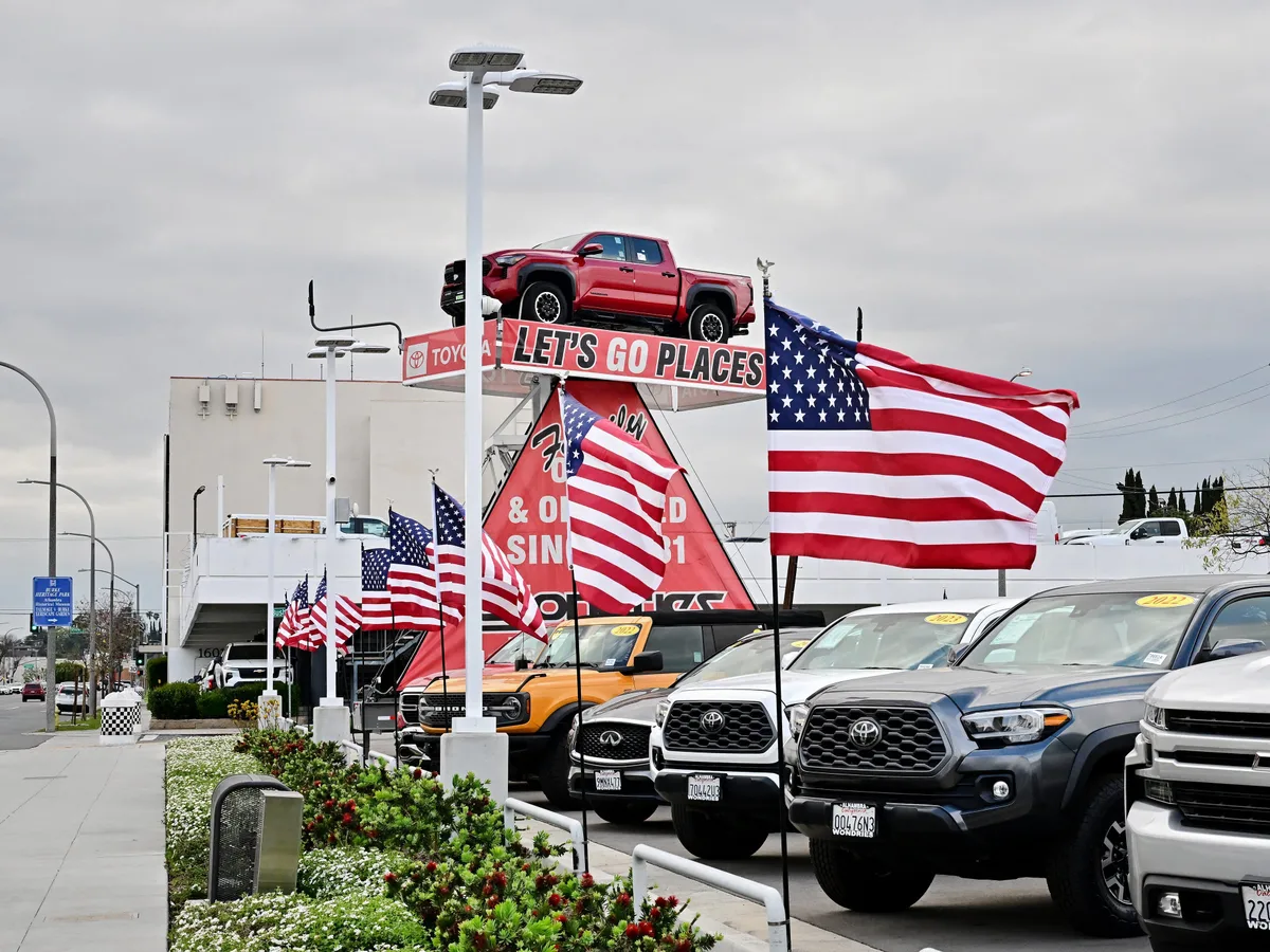 Buyers are shopping for cheaper cars. New-car prices are still near a record.