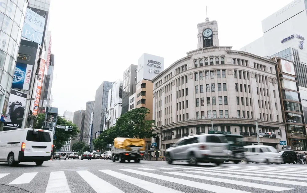 Foreign travelers sitting on sidewalks of Tokyo’s Ginza are Japan’s latest tourism culture clash