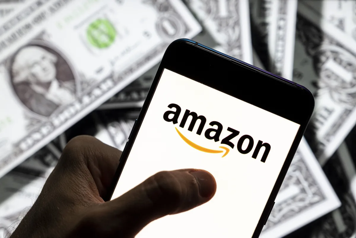Amazon raises minimum wage by $1