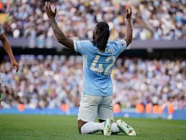 Man City wins 8-goal thriller against Sunderland to move clear at top of Premier League
