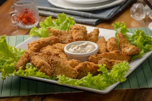 Homemade fish fingers with tartar sauce for a crispy family favourite