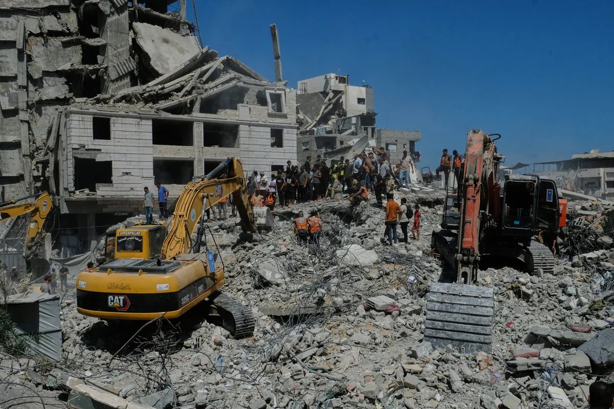 War-damaged Gaza building collapses killing 19 as perilous conditions persist during truce