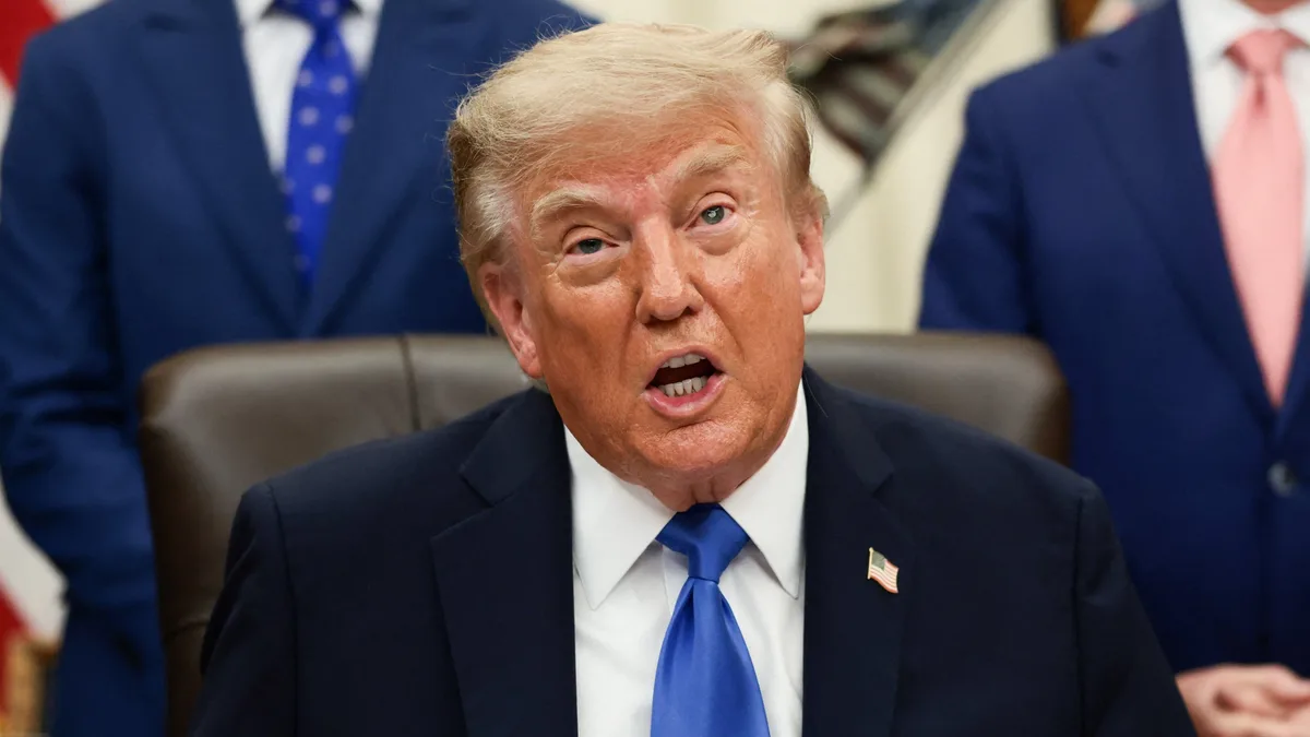 Trump Shows Off Absurd New Gold Toy