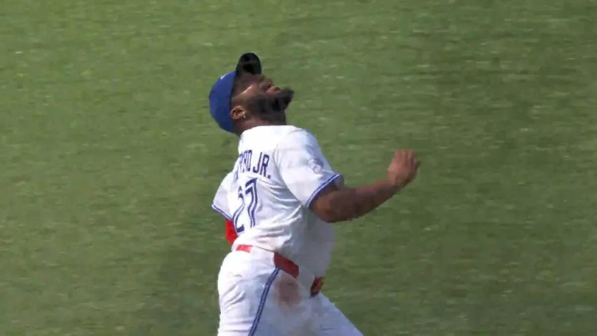 Guerrero Jr. makes acrobatic running grab before spilling into stands