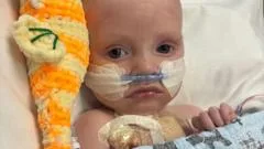 Baby whose parents feared had just days to live is 'thriving' after life-saving heart operation