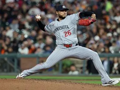 Bradley passes 200 strikeouts, pitches Twins to 3-2 win over Giants