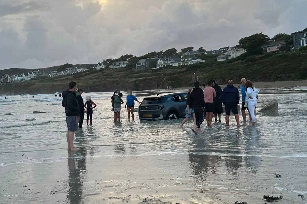 Tourist’s electric car almost swept out to sea on UK beach