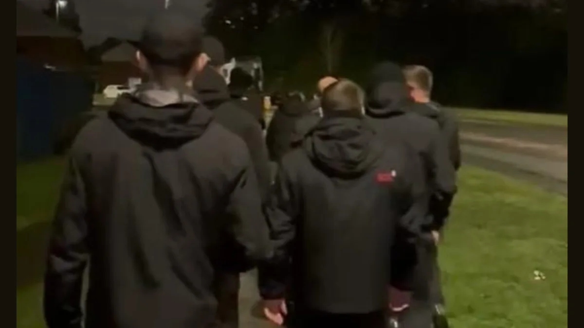 Go home: Dressed in all black, UK vigilantes bar Indian students from park