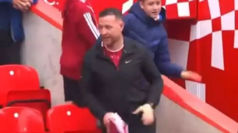 Liverpool fan snatches shirt from kid
