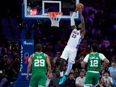 LeBron James tosses chalk, gets 76ers intro for 1st time in Philadelphia in front of roaring fans