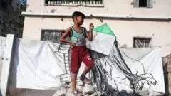 Israel warns of 'forceful' response to kites flown from Gaza