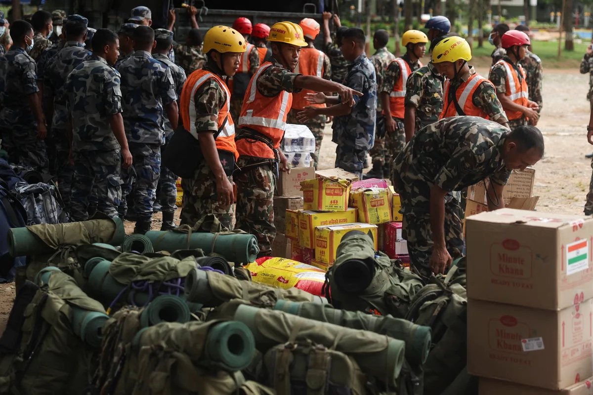 Nepal races to rescue hundreds trapped in flood-hit tunnels