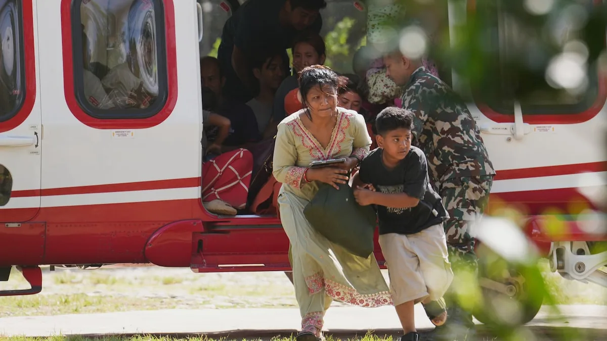 Death toll rises in Nepal-China border disaster as lake poses new flood threat