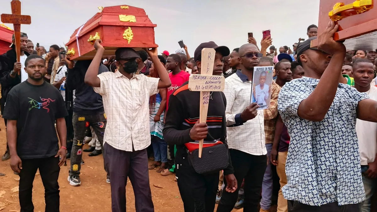 Hundreds gather in eastern Congo to mourn victims of school fires