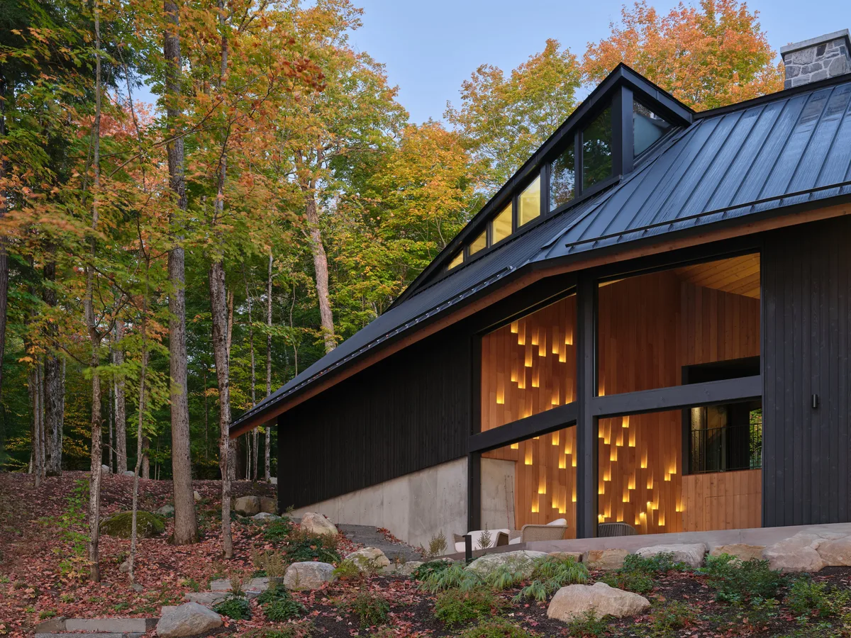 With a zinc roof, cathedral ceilings and stone hearth, this family cottage is built for awe