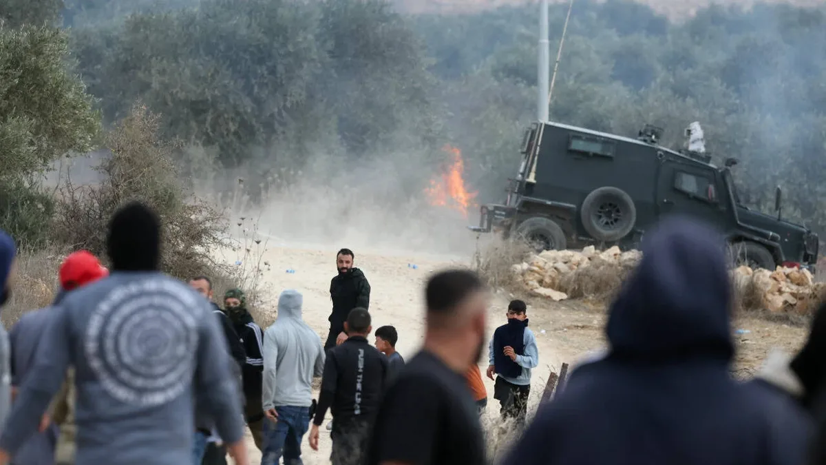 Israeli settlers attack Palestinian villages, torch cars and trees during olive harvest
