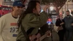 Chris Martin joins busker for impromptu duet