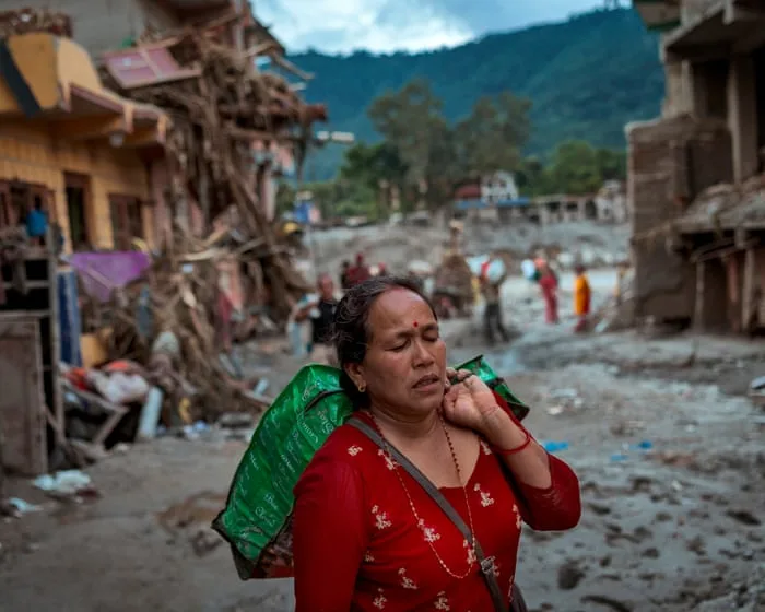 Nepal-Tibet death toll rises amid new flood fears and race to free group trapped in tunnel
