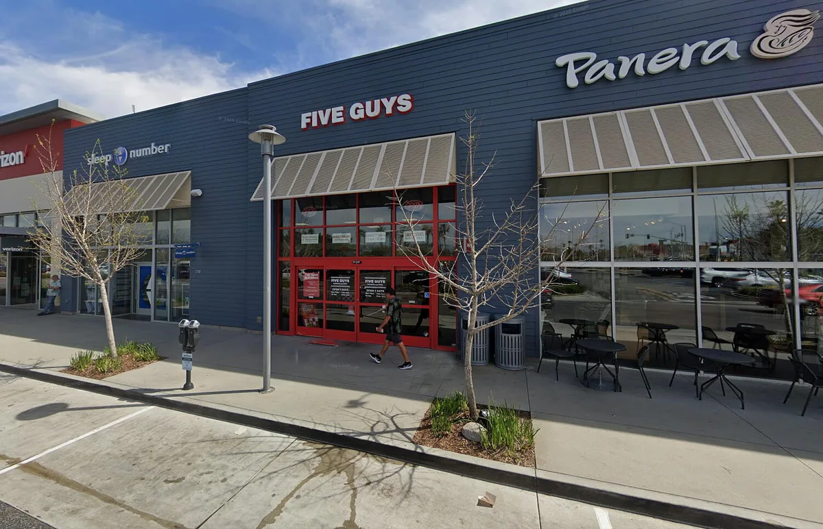 Teenage Five Guys worker hit by stray bullet while on the job