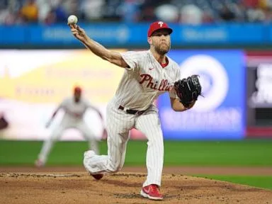 Wheeler fans 7 straight to open game, Stott hits tiebreaking RBI single as Phillies beat Brewers 6-4