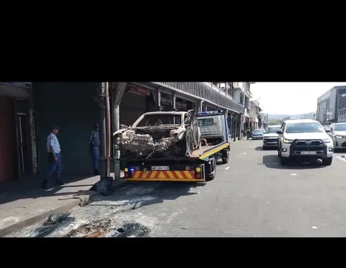 Cachalia walks Durban CBD as 14 burnt-out vehicles are removed after anti-immigration protest