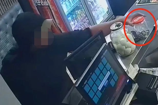 Brazen moment shameless thief swipes tip jar at fish and chip shop and runs off