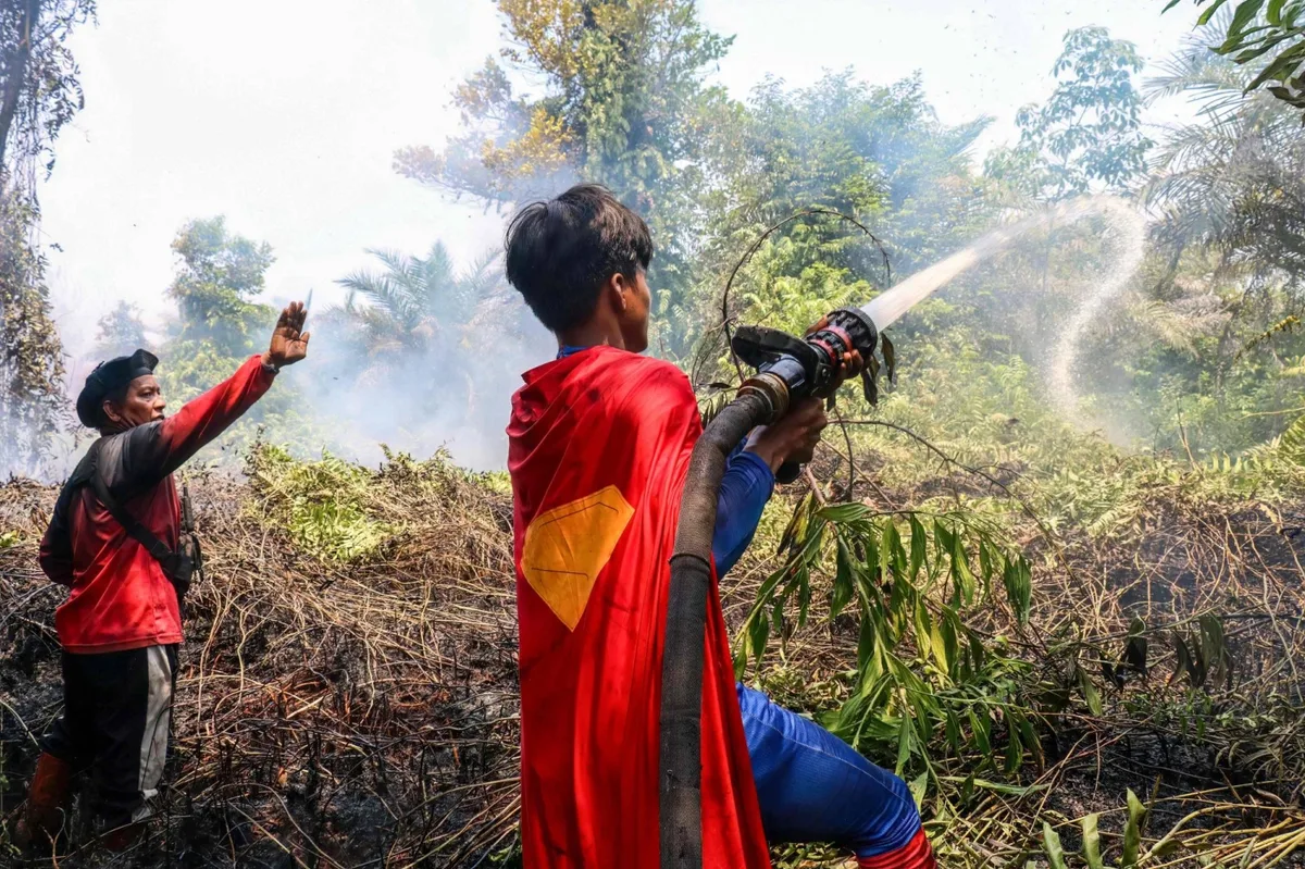 ‘Keep up the spirit’: Indonesian teenage Superman joins wildfire fight