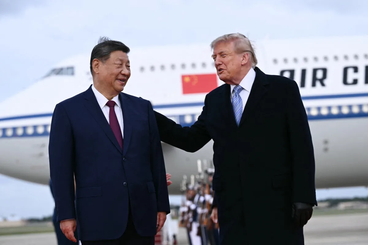China, U.S. extend trade truce as Xi receives rare planeside welcome from Trump