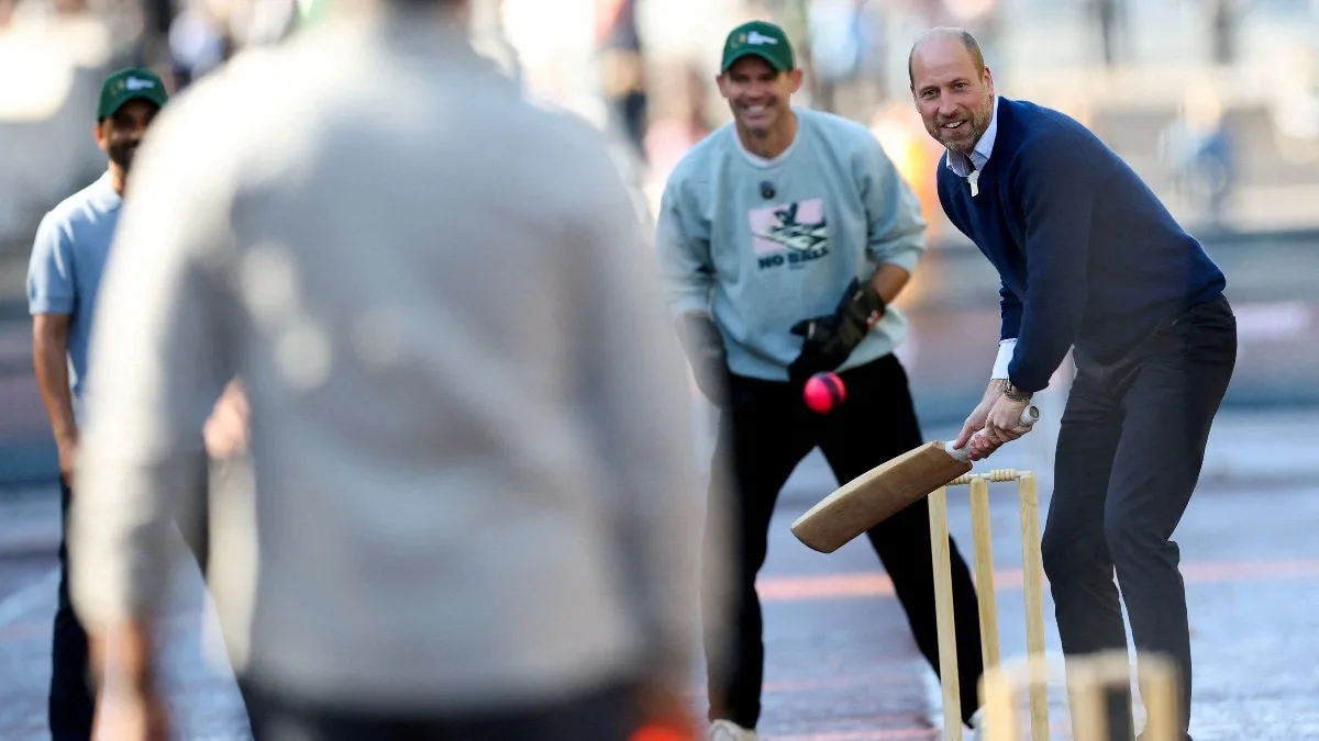 Prince William halts traffic outside Buckingham Palace for cricket with stars