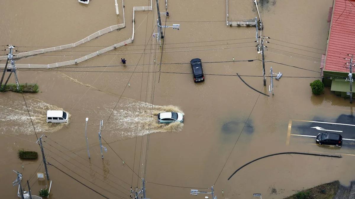 Heavy rain causes flooding near Tokyo that kills 4 and strands travelers