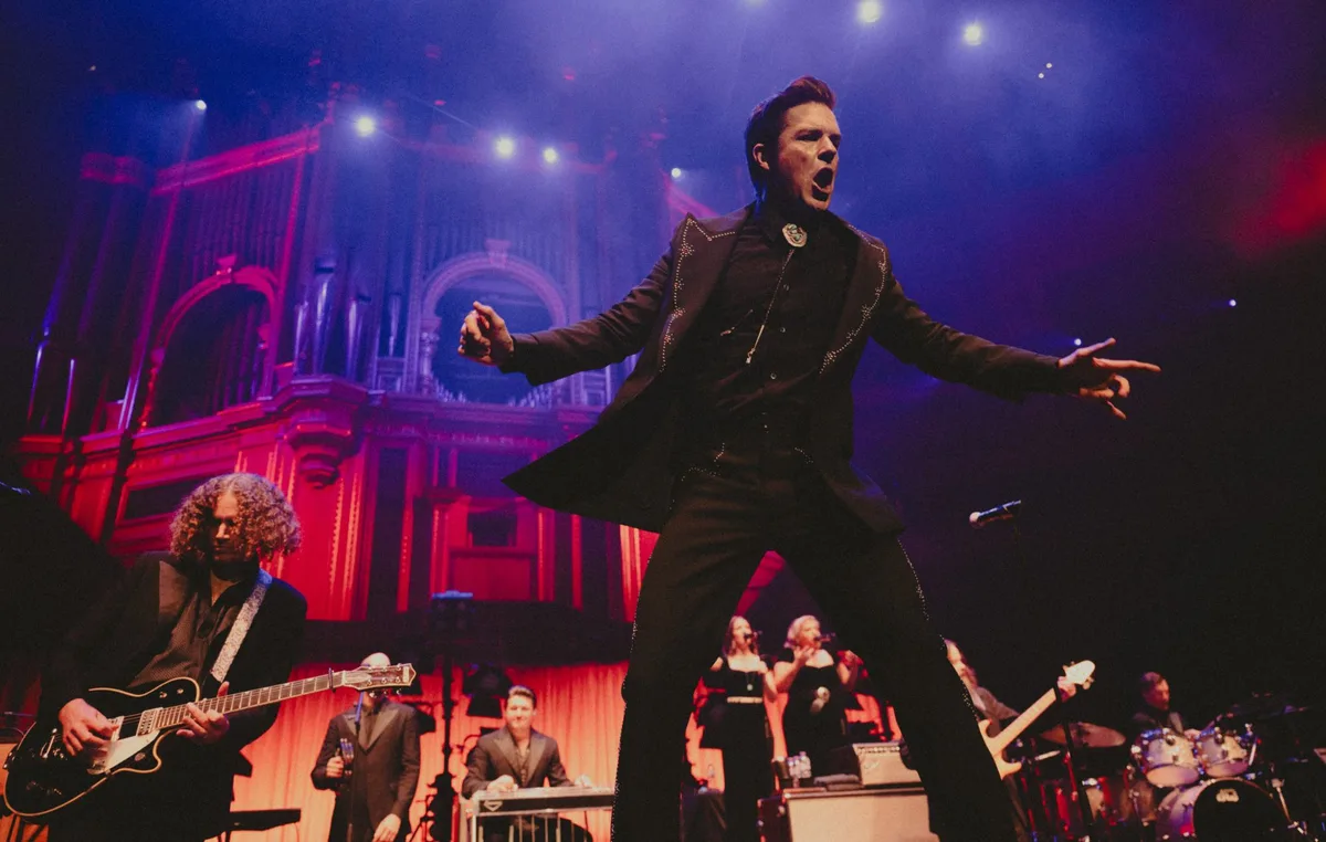 Brandon Flowers imagines “what would New Order sound like if they were Johnny Cash” at spellbinding Royal Albert Hall gig