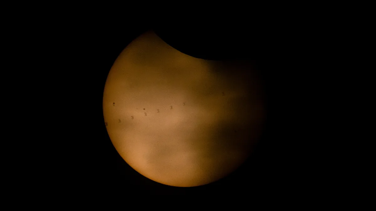 ISS photobombs the sun during solar eclipse | Space photo of the day for Aug. 14, 2026