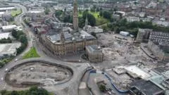 Swinney visits 'crisis' towns asking for help after 1,500 job losses