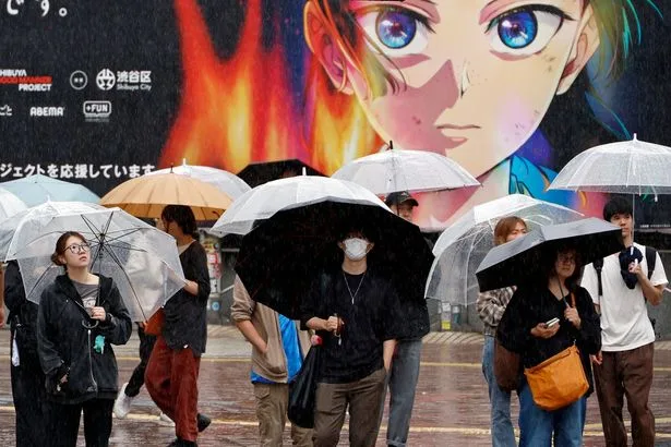 Japan typhoon causes travel chaos with 500 flights cancelled and tourist attractions closed