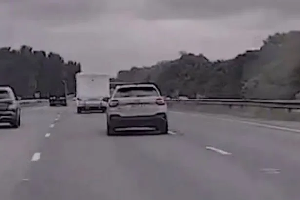 Shocking moment Audi driver weaves through M56 traffic in 165mph police chase
