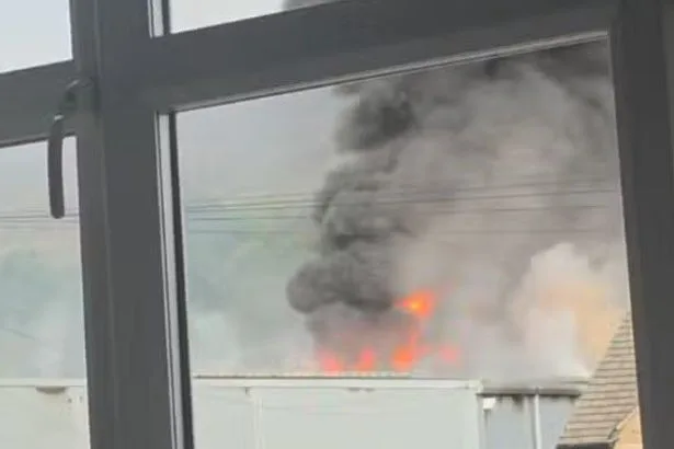 Huge blaze in Greenfield forces Tesco to close as firefighters warn 'stay away'
