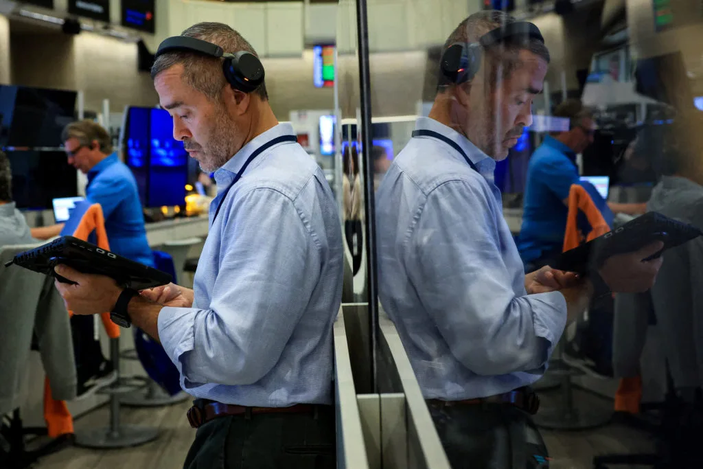 Stocks slip on Wall Street under pressure from rising oil prices, bond sell-off