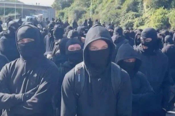 Man becomes first arrested for 'concealing his identity' hours after face covering ban