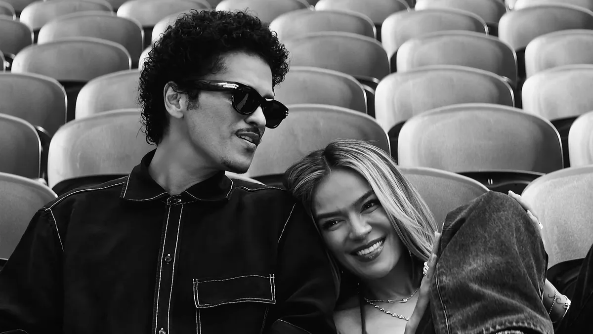 Karol G and Bruno Mars Fill a Stadium With Love in ‘Still’ Video