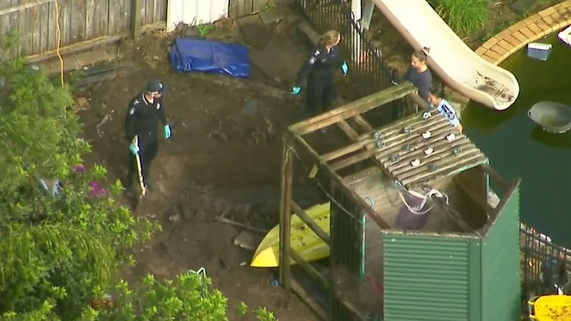 Human remains found on remote property, two charged over cold case