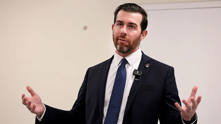 Socialist in Trump country gives Karl Marx vision thumbs-up before ducking key tax question