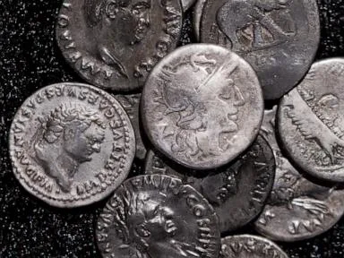 Amateur archaeologist finds Germany’s biggest hoard of ancient Roman silver coins
